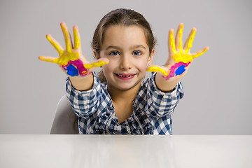 Image showing Little girl with hands in paint