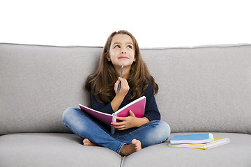 Image showing LIttle girl studying