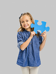 Image showing Girl holding a puzzle