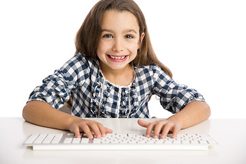 Image showing Little girl working with a computer