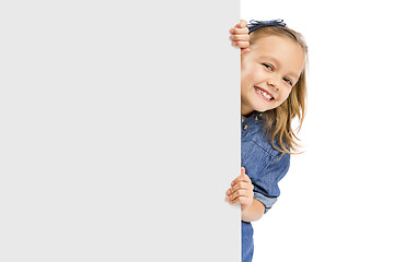 Image showing Cute Girl holding a whiteboard