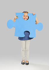 Image showing Girl holding a puzzle