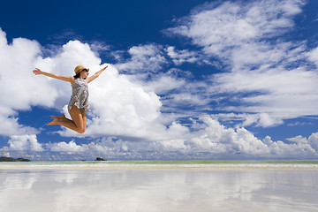 Image showing Beautiful woman jumping at the beach