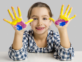 Image showing Little girl with hands in paint