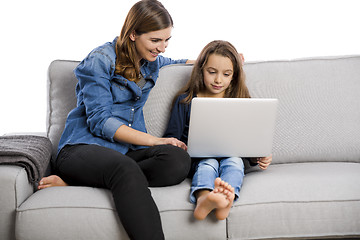 Image showing Mother teaching her little daughter