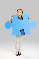 Image showing Girl holding a puzzle