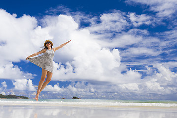 Image showing Beautiful woman jumping at the beach