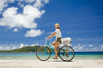 Image showing Woman ride along The Beach