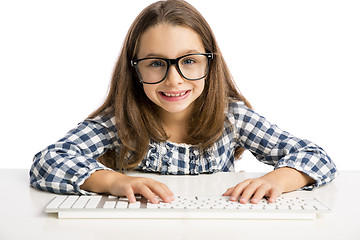 Image showing Little girl working with a computer