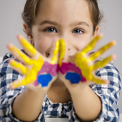 Image showing Little girl with hands in paint