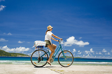 Image showing Woman ride along The Beach