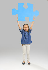 Image showing Girl holding a puzzle