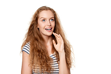 Image showing Excited teen girl looking to the side in amazement.