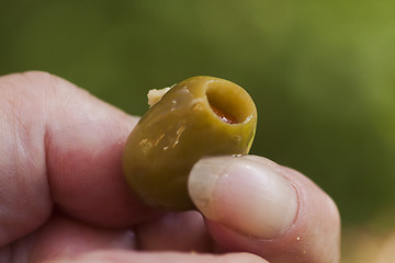 Image showing hand with an olive