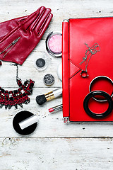 Image showing Red clutch bag and ladies accessories