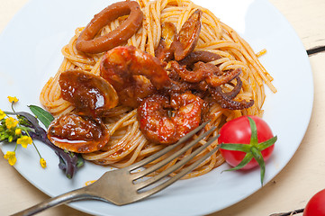 Image showing Italian seafood spaghetti pasta on red tomato sauce 