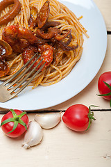 Image showing Italian seafood spaghetti pasta on red tomato sauce 