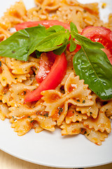 Image showing Italian pasta farfalle butterfly bow-tie and tomato sauce