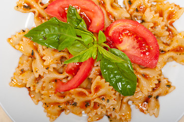 Image showing Italian pasta farfalle butterfly bow-tie and tomato sauce