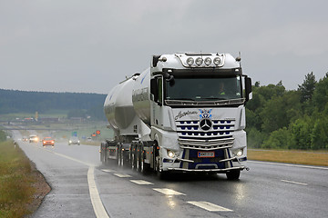 Image showing White Mercedes-Benz Actros Tank Truck Trucking in Rain