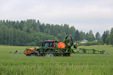 Image showing Tractor and Mounted Sprayer on Wheat Field