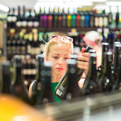 Image showing Woman shopping groceries at supermarket.