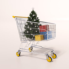 Image showing Shopping cart full of purchases in packages and Christamas tree