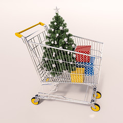 Image showing Shopping cart full of purchases in packages and Christamas tree