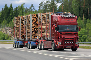 Image showing Red Scania Logging Truck Pulp Wood Haul on Motorway