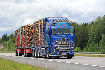 Image showing Customized Volvo FH16 Transports Pulp Wood along Freeway