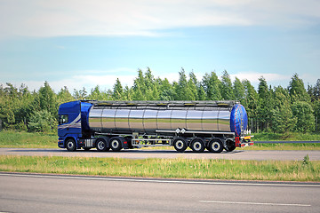 Image showing Blue Semi Tank Truck on Freeway at Summer