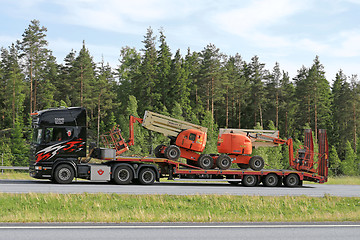 Image showing Scania Truck Hauls Aerial Work Platforms along Freeway 
