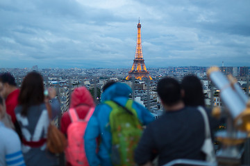 Image showing Tourist taking photos of Paris cityscape with Eiffel tower.