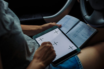 Image showing woman with a tablet looking into Notepad