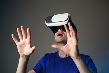 Image showing Young man using a VR googles.