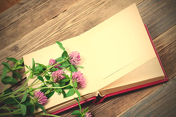 Image showing album and clover flowers with copy space