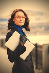 Image showing woman with glasses and laptop outdoors