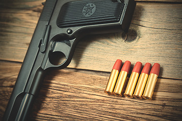 Image showing cartridges near the old gun