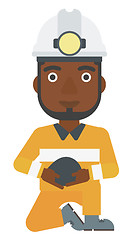 Image showing Miner holding coal in hands.