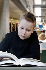 Image showing Young boy reading