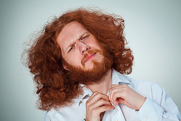 Image showing The young man looking at camera