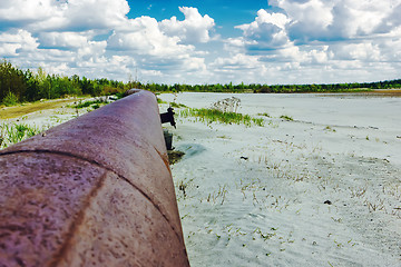 Image showing Rusty pipeline to the horizon