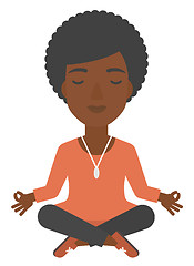 Image showing Business woman meditating in lotus pose.