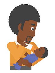 Image showing Man feeding baby.