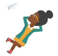 Image showing Business woman relaxing on cloud.