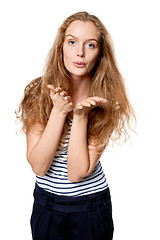 Image showing Woman blowing a kiss at camera