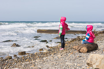 Image showing Two girls on the beach looking into the distance