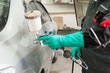 Image showing painting a car