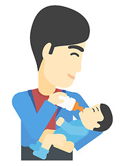 Image showing Man feeding baby.