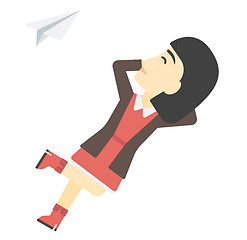 Image showing Business woman relaxing on cloud.